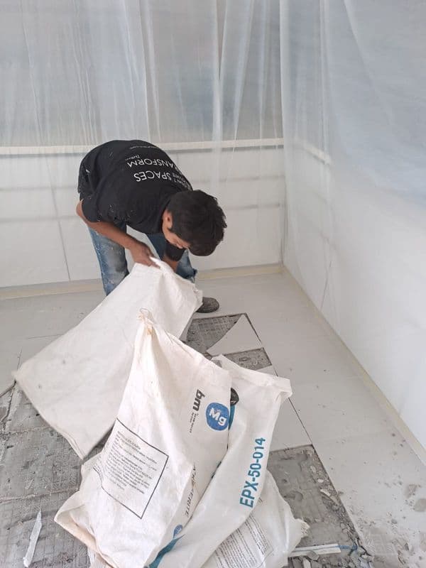 What is floor hacking and tile removal?